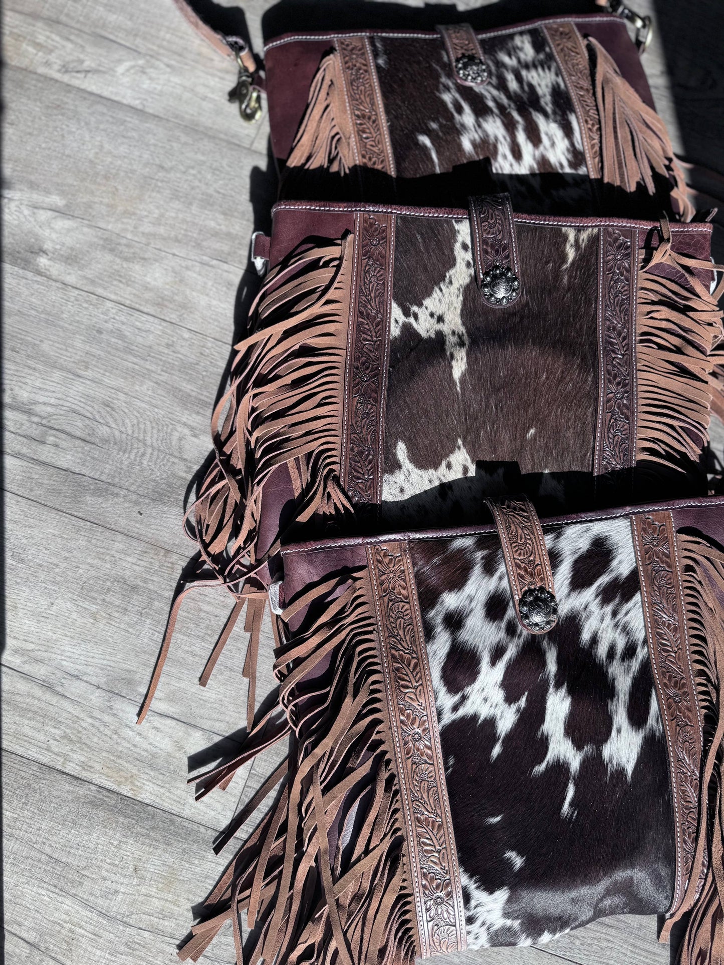 Leather tooled cowhide bag W/fringe 
